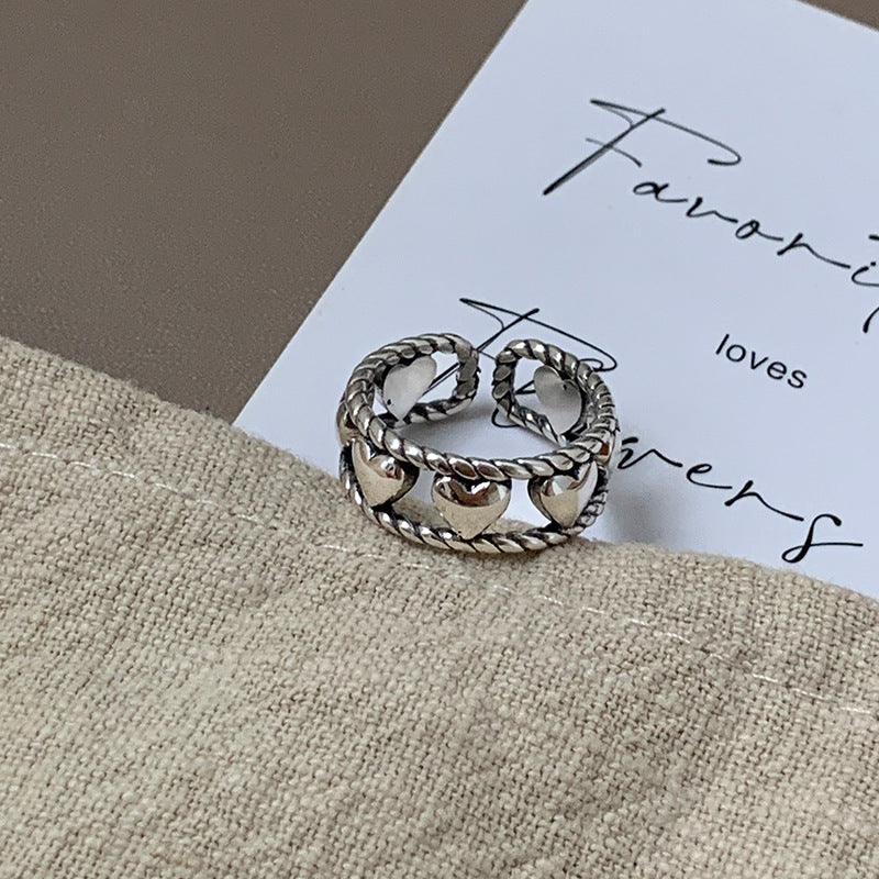 Damenring mit künstlerischem Herzdesign und filigraner Struktur Shop Nory