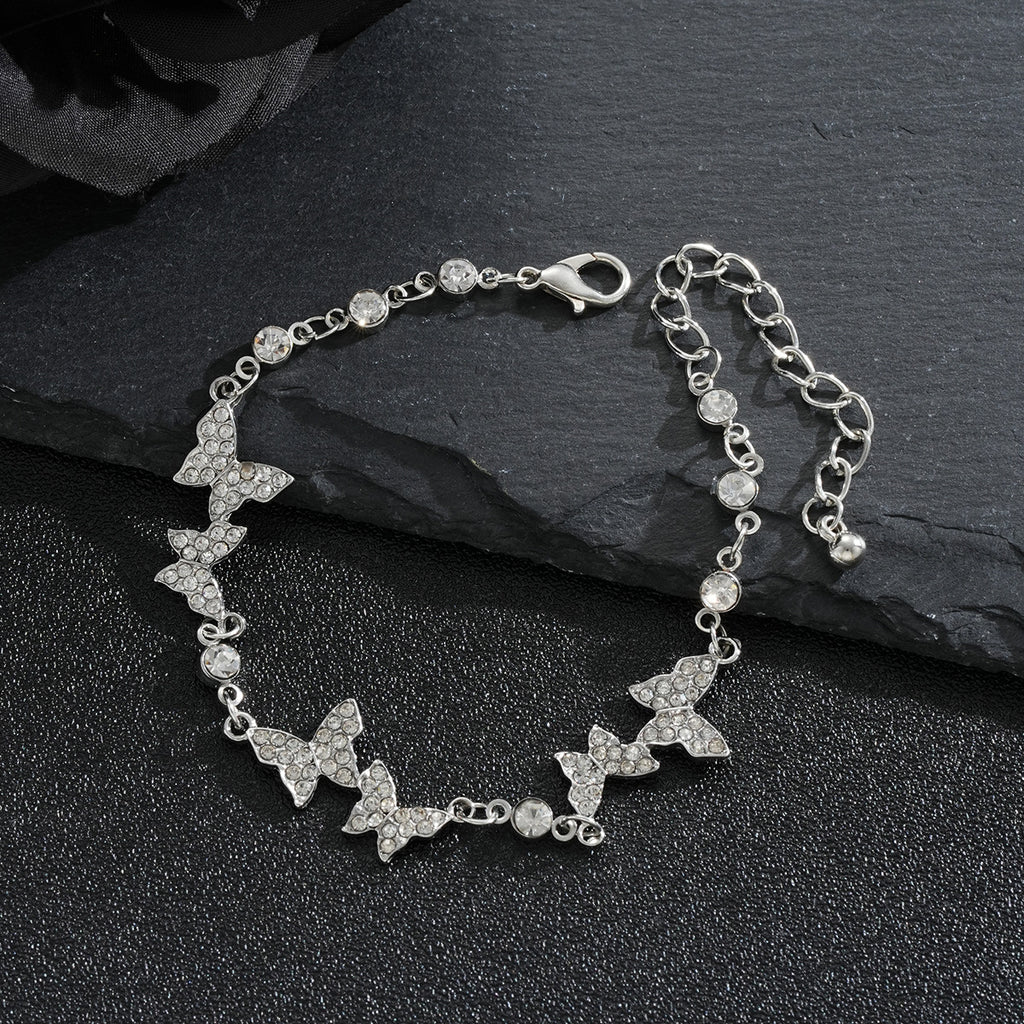 Damenarmband mit funkelnden Schmetterlingen Shop Nory