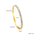 Damen Armreif mit funkelnden Zirkonia-Akzenten und elegantem Goldüberzug Shop Nory