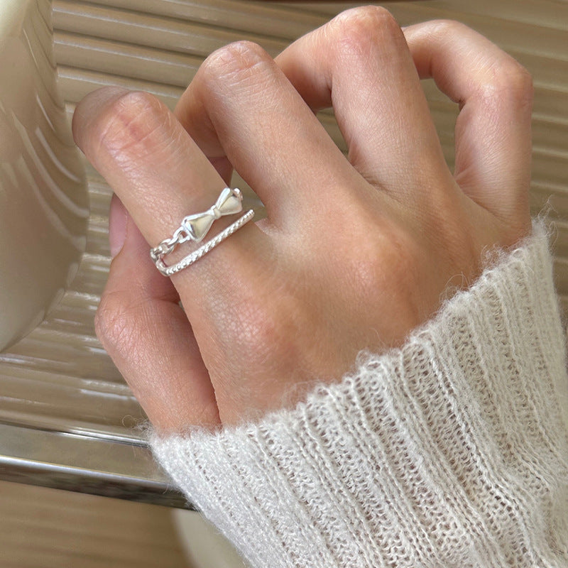 Damen zierlicher Ring mit verspieltem Schleifenmotiv und feinen Zirkonia Akzenten Shop Nory