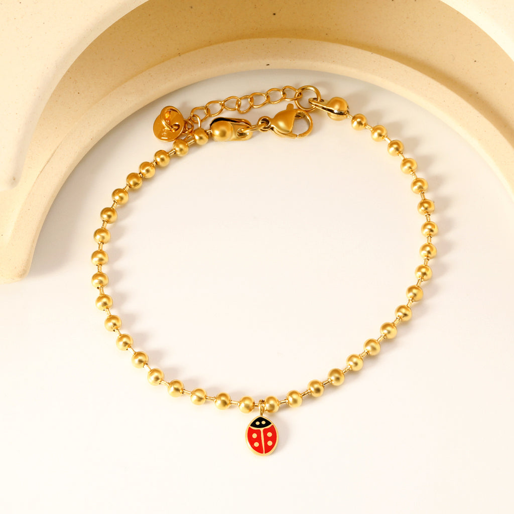 Damen Armband mit bezauberndem Marienkäfer-Anhänger und stilvollem Design Shop Nory