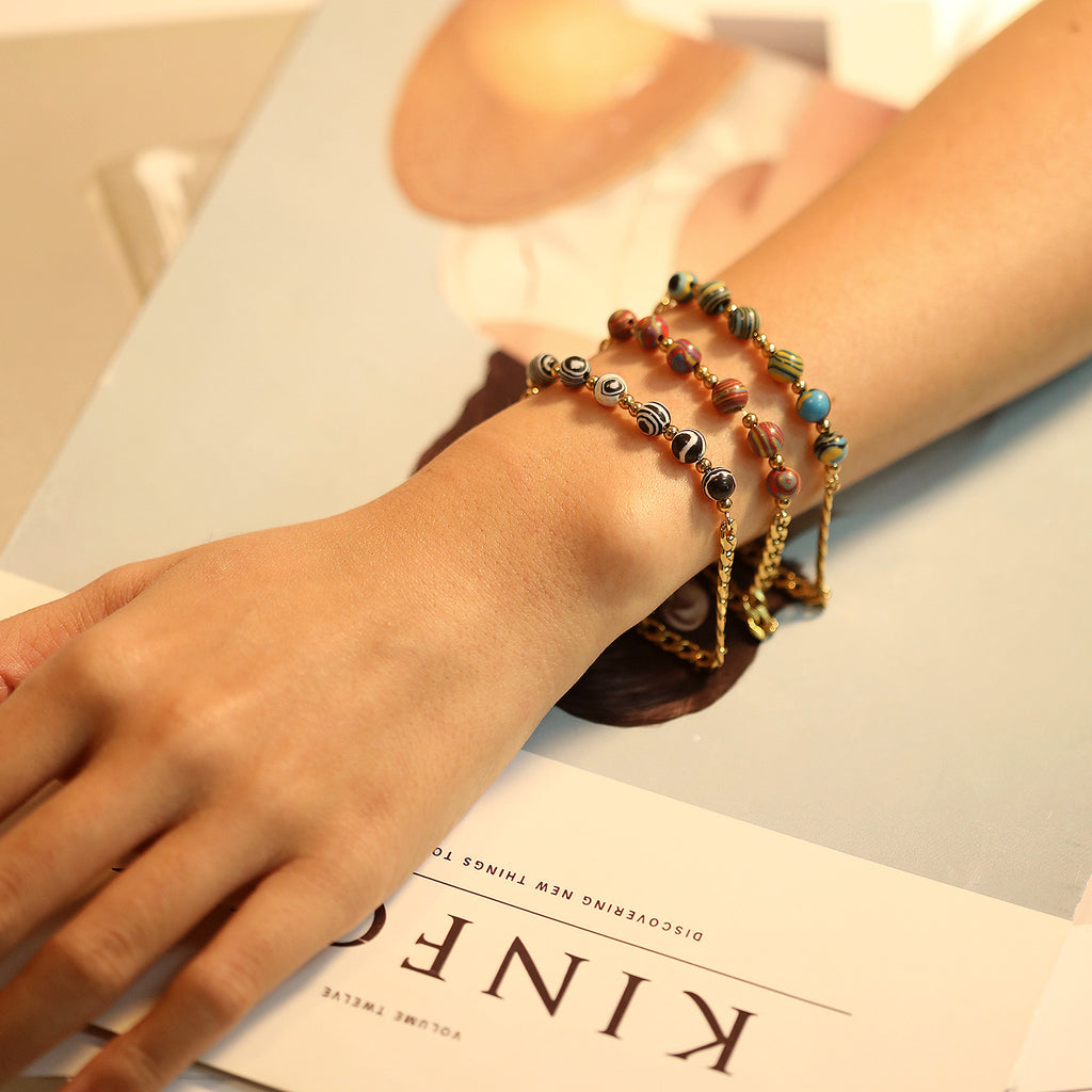 Damen Armband mit glänzender Gliederkette und elegantem Zebra-Muster Shop Nory