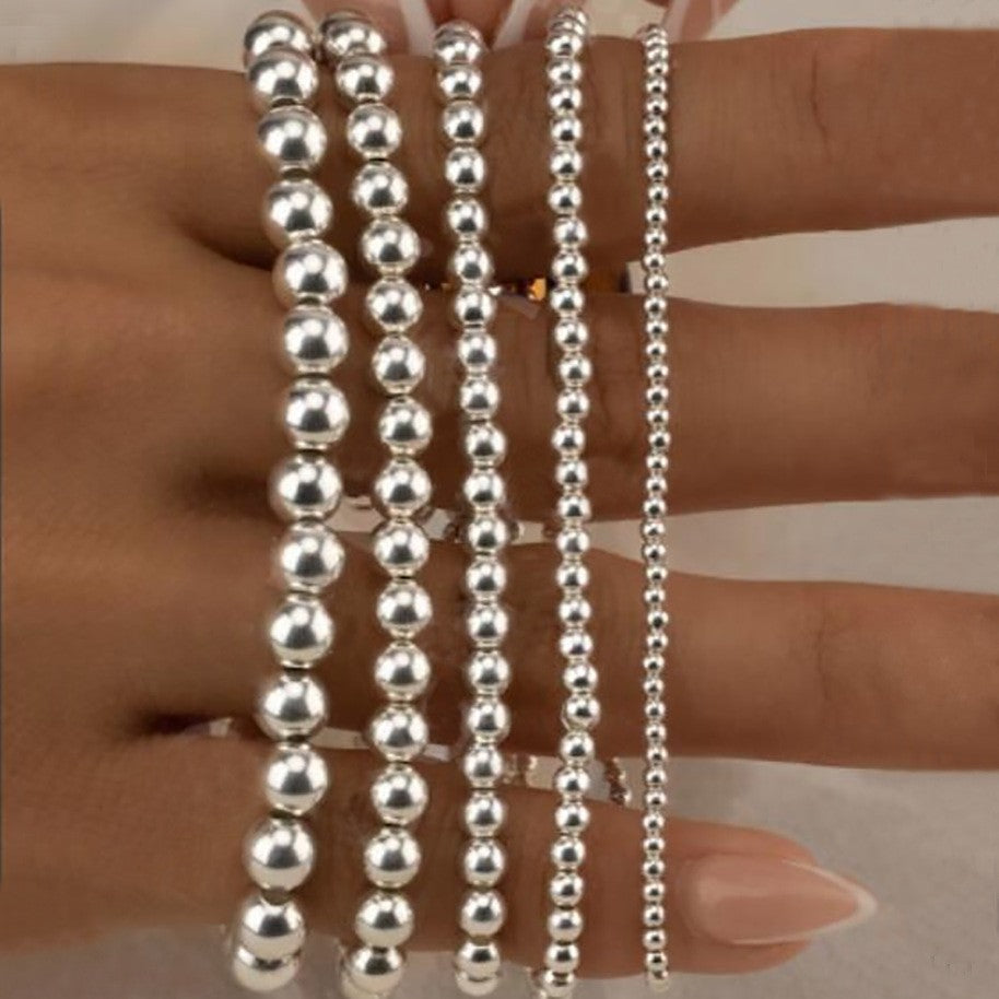 Damen Armband-Set mit funkelnden Perlen und eleganten Details Shop Nory