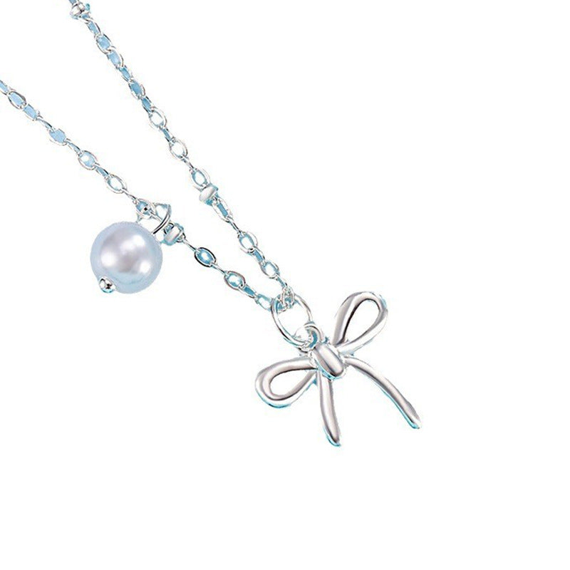 Damen Kettenanhänger mit Schleifenmotiv und Perle Shop Nory