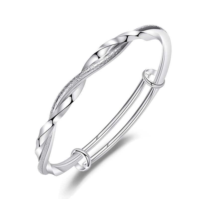 Damen eleganter Armreif mit kunstvoller Drehung und funkelndem Zirkonia Shop Nory