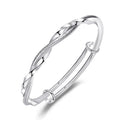 Damen eleganter Armreif mit kunstvoller Drehung und funkelndem Zirkonia Shop Nory