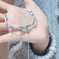 Damen Armband mit kunstvollem Blattdesign und zarten Kettendetails Shop Nory
