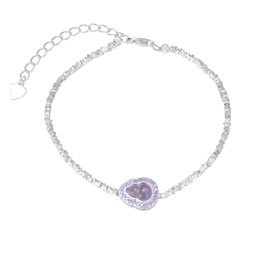 Damen Armband mit herzförmigem Amethyst-Anhänger und funkelnden Kristallelementen Shop Nory