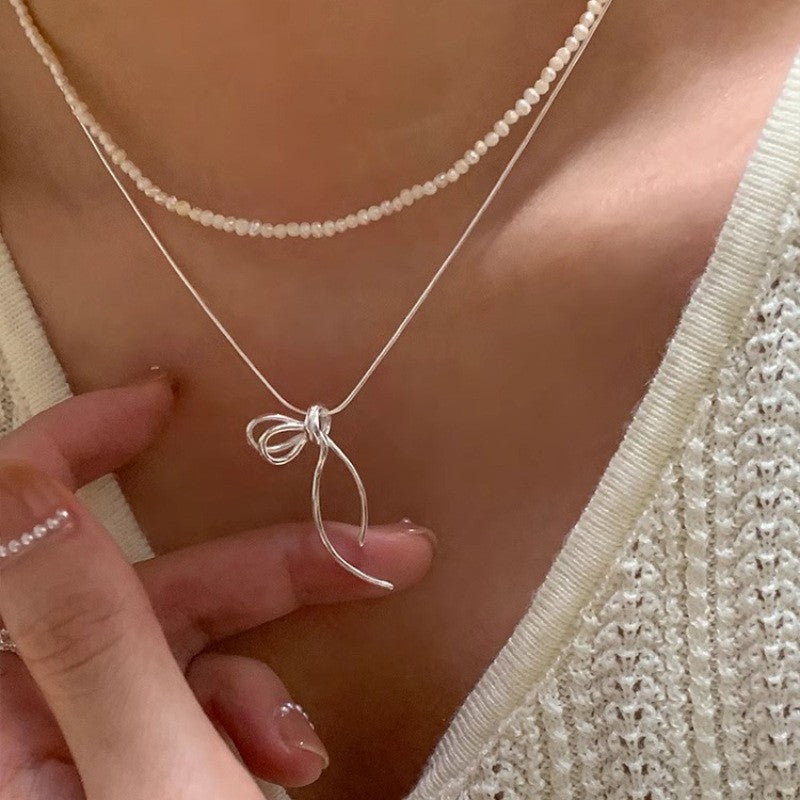 Damen Halskette mit elegantem Schleifenanhänger Shop Nory