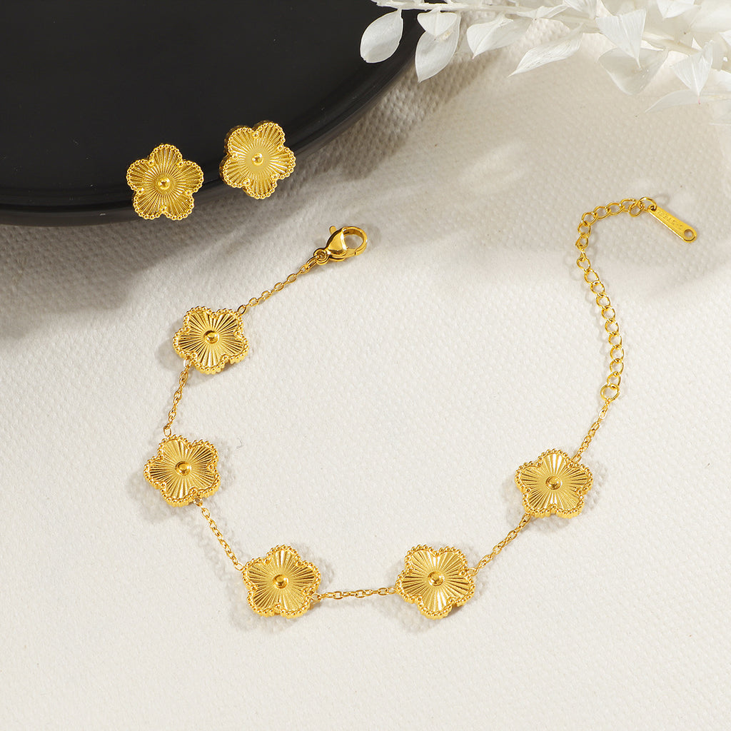 Damen zierliches Blumenarmband mit goldenen Details Shop Nory