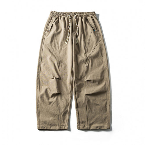 Unisex Weite Cropped-Hose mit Tunnelzug, elastischem Bund und markanten Nahtpaneelen Shop Nory