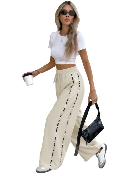 Damen Weite High‑Waist Loungehose mit Kordelzug und kontrastierenden Seitenstreifen Shop Nory