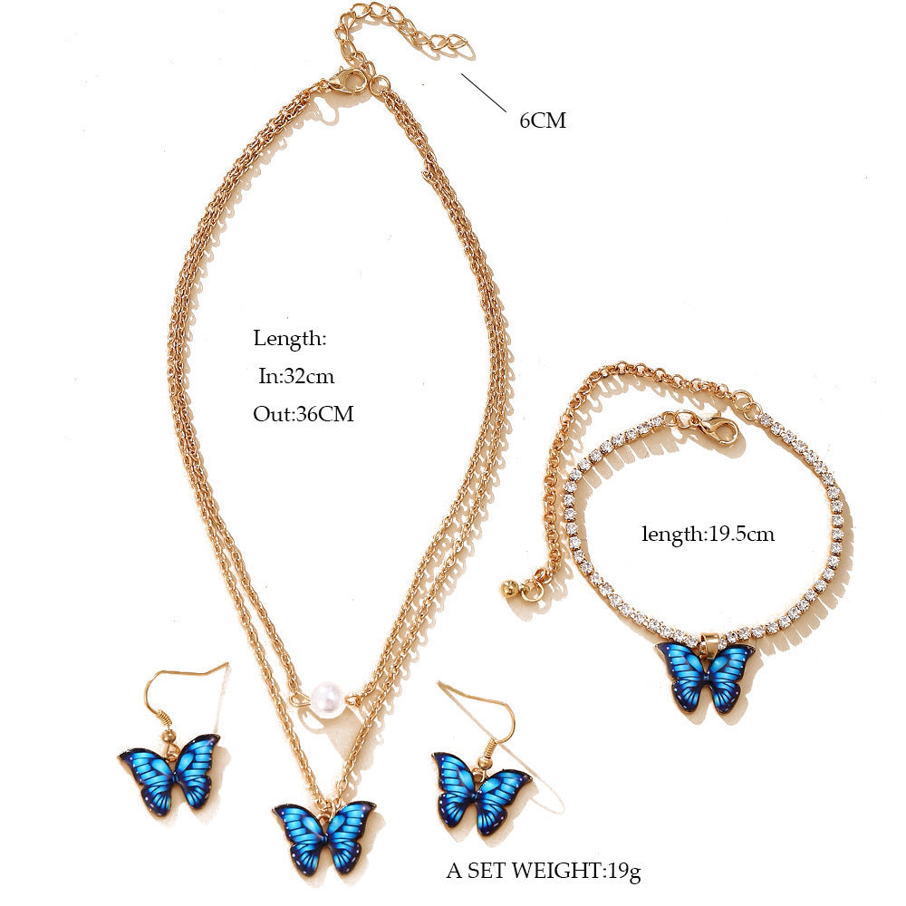 Damen Schmuckset mit schimmernden Schmetterlingsanhängern und funkelnden Elementen Shop Nory
