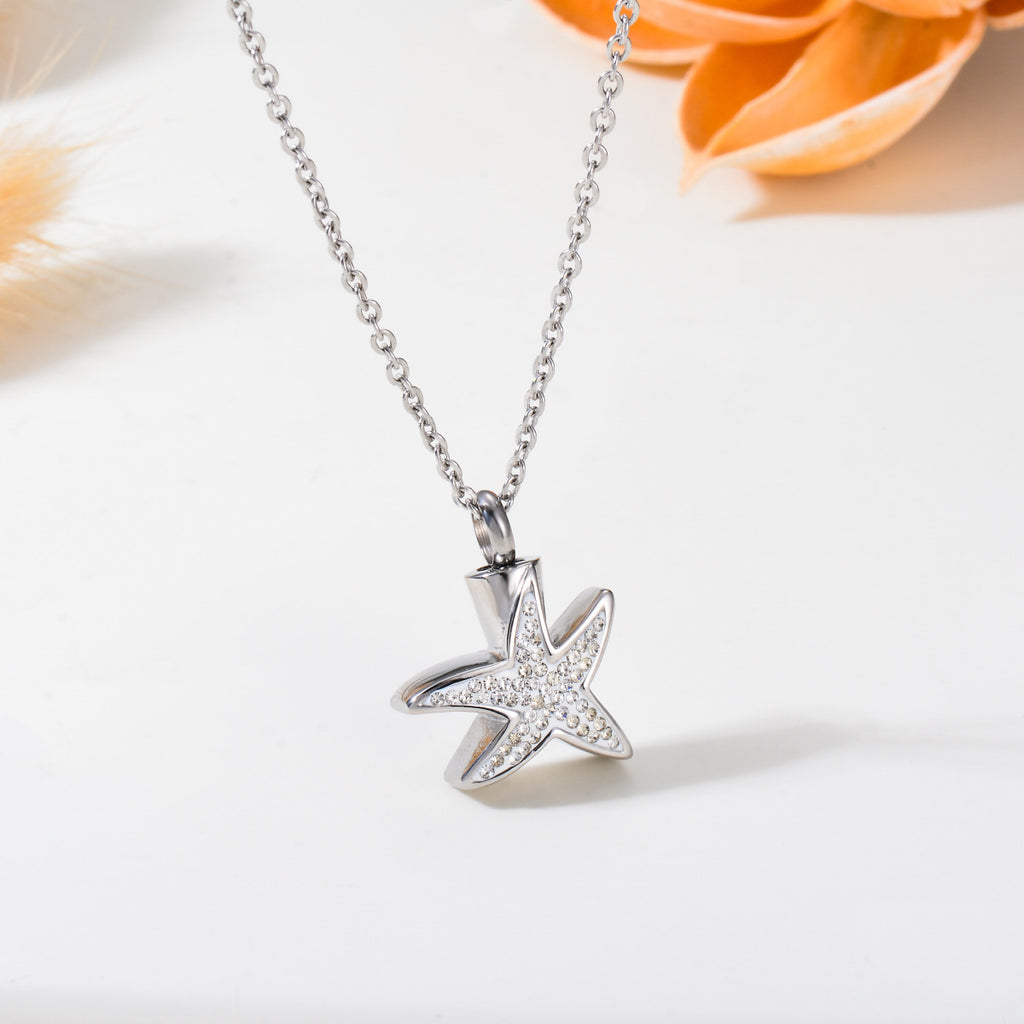 Damen Schmuckanhänger in Form eines Seesterns mit funkelnden Zirkonia Shop Nory