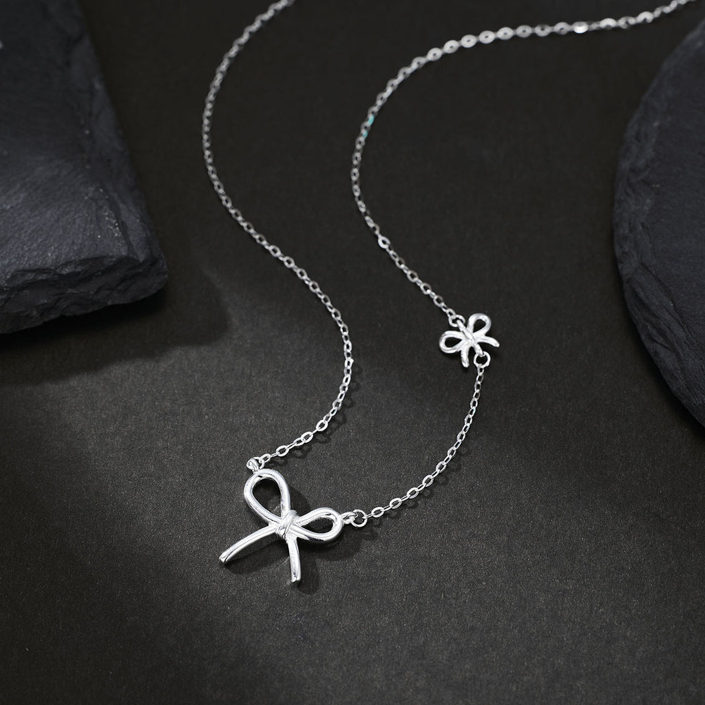 Damen Halskette mit kunstvollem Schleifenanhänger und feiner Gliederkette Shop Nory