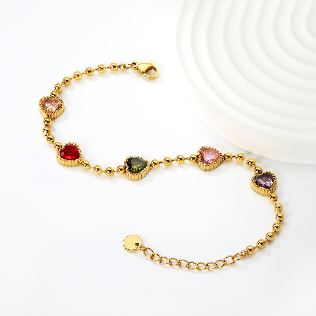 Damen Armband mit herzförmigen, bunten Kristallanhängern und goldplattiertem Design Shop Nory