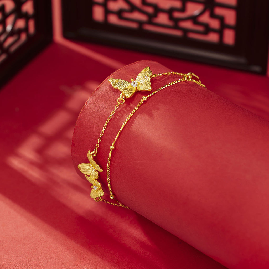 Damen Armband mit kunstvollen Schmetterlingsanhängern Shop Nory
