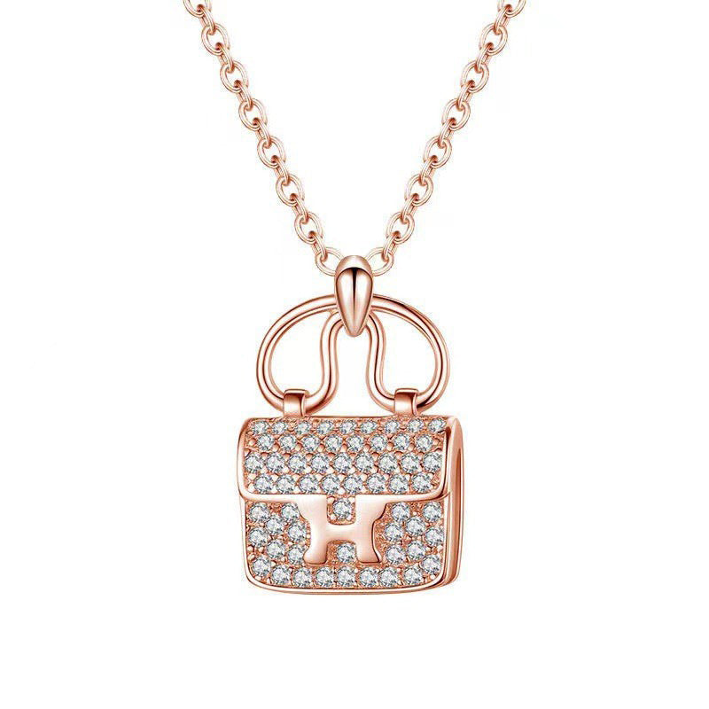 Damen Halskette mit kunstvollem Handtaschen-Anhänger aus funkelndem Zirkonia Shop Nory