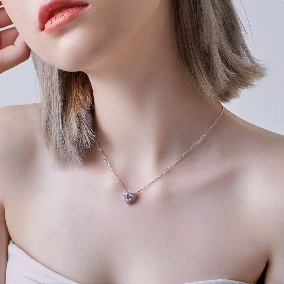 Damen Halskette mit funkelndem Herzanhänger und hochwertigen Kristallverzierungen Shop Nory