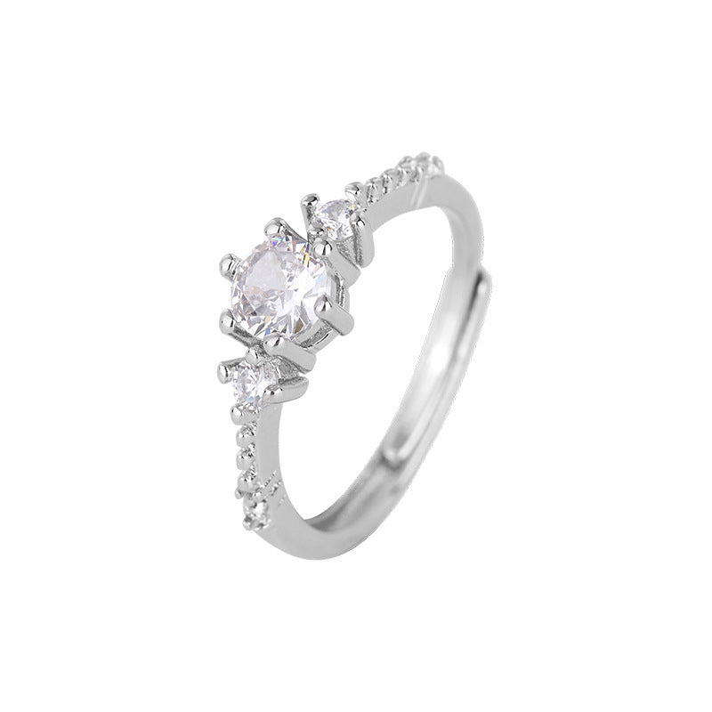 Damen Zarter Verlobungsring mit funkelnden Zirkonia-Steinen und filigranem Design Shop Nory
