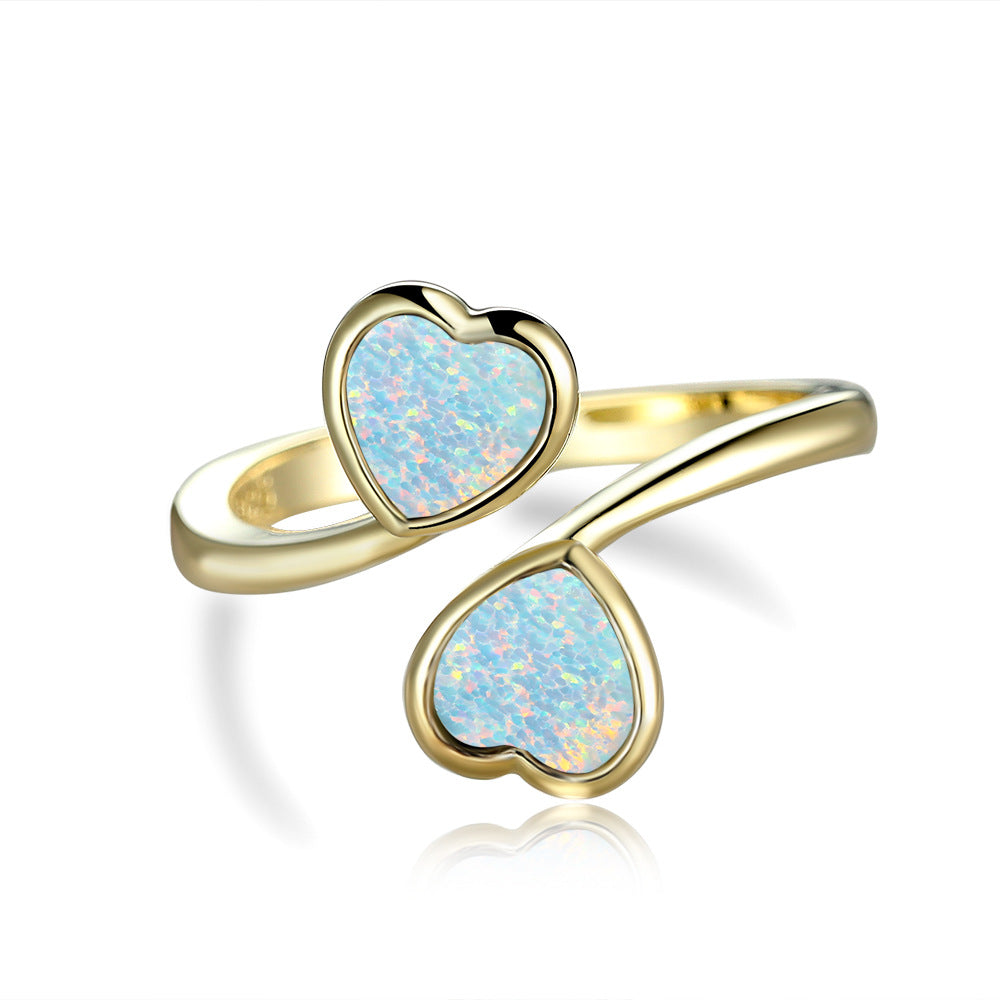 Damen Ring mit strahlendem Herzdesign und leuchtenden Opal-Effekten Shop Nory
