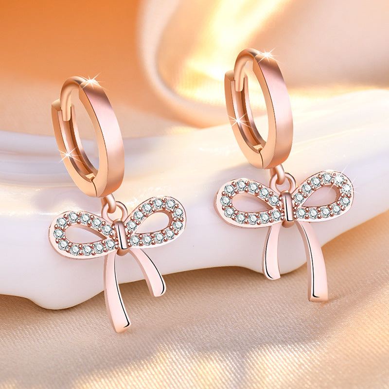 Damen Ohrstecker mit funkelndem Schleifen-Design und eleganten Zirkonia-Details Shop Nory