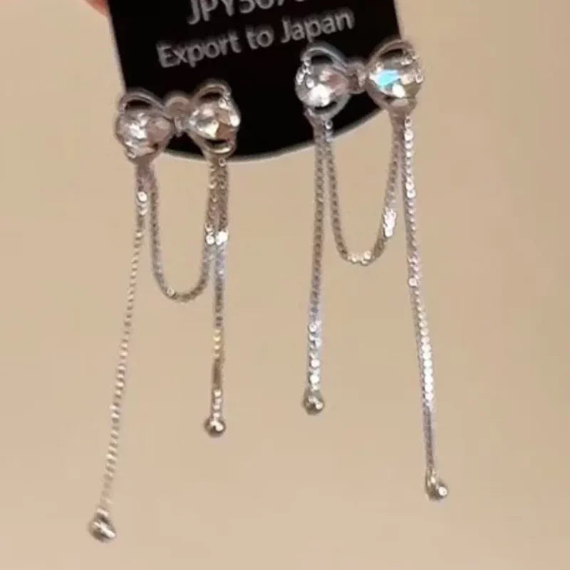 Damen Ohrstecker mit eleganten Schleifen und funkelnden Akzenten Shop Nory