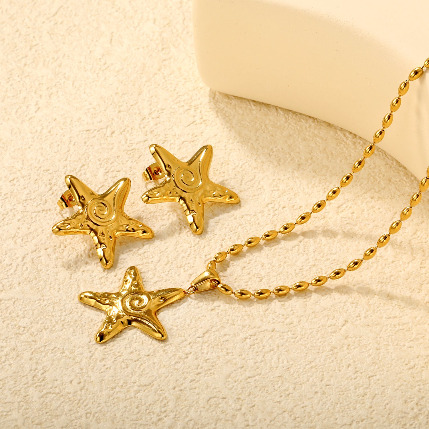 Damen Schmuckset mit glänzendem Sternenanhänger und passenden Ohrsteckern Shop Nory