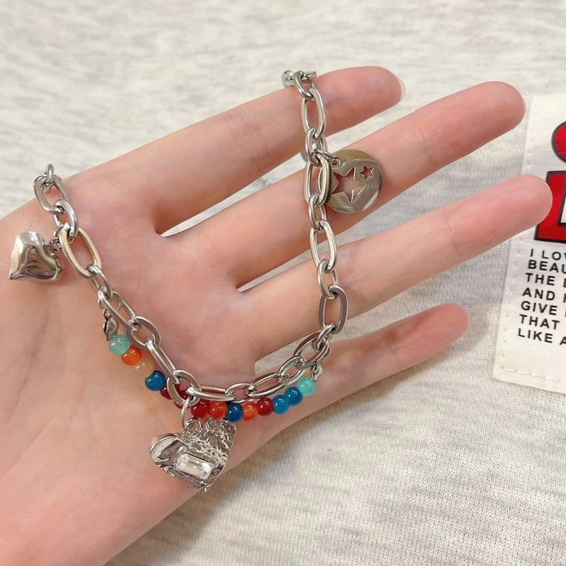 Damen Armband mit bunten Perlen und charmanten Herzanhängern Shop Nory
