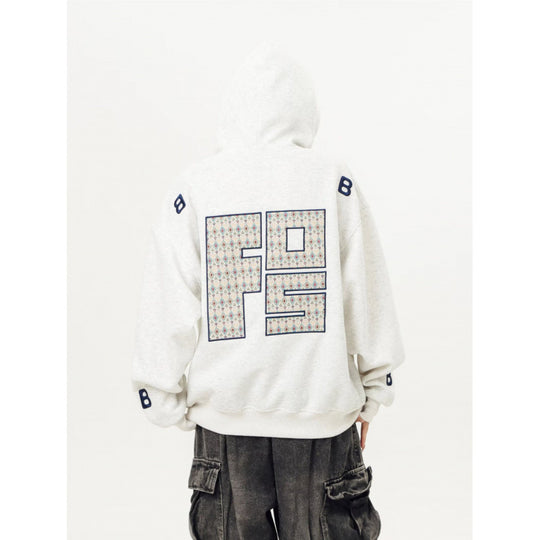 Unisex Oversized Kapuzenpullover mit großflächigem Intarsien‑Blockprint und geripptem Saum Shop Nory