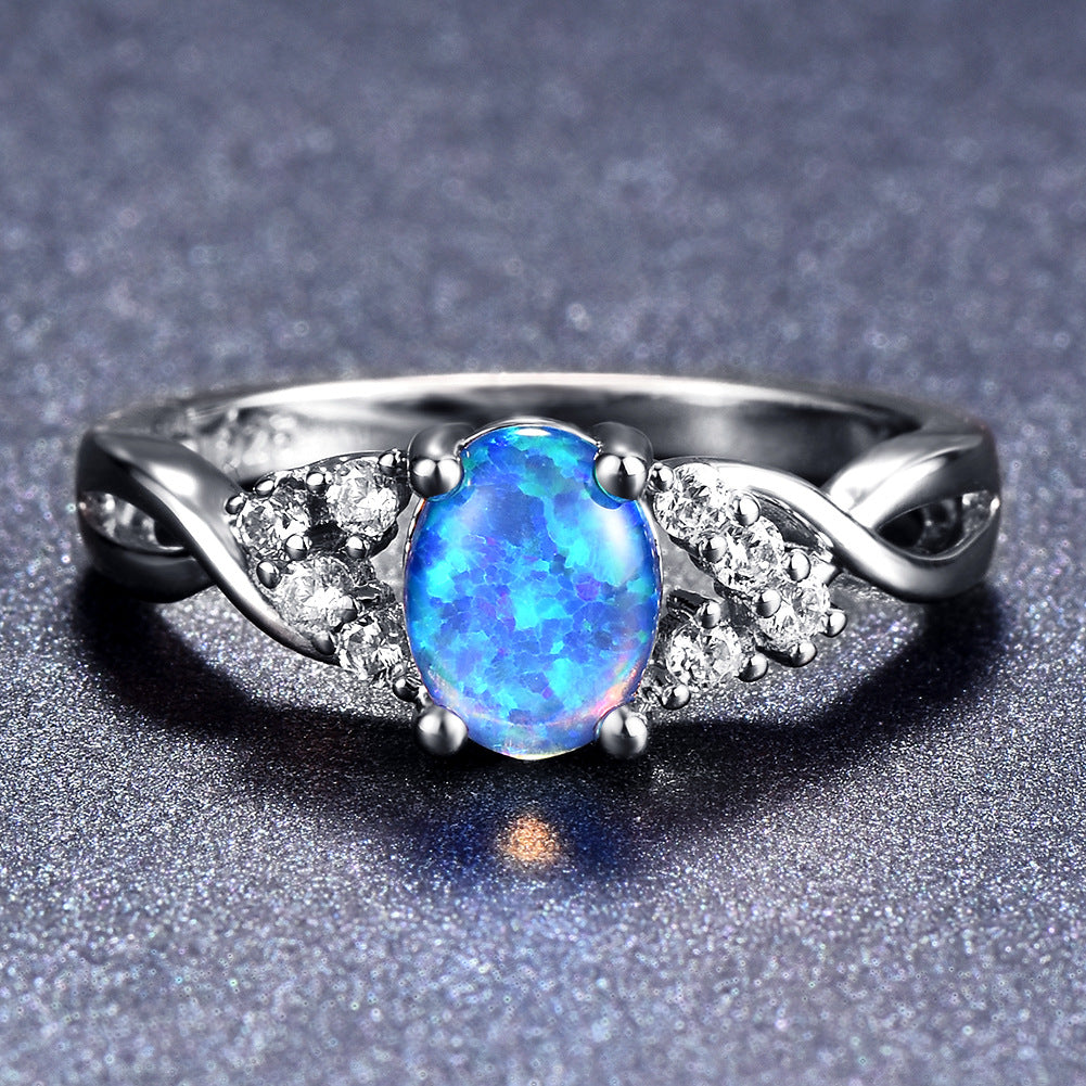 Damen Ring mit schimmerndem Opal und Zirkonia-Verzierungen Shop Nory