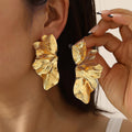 Damenohrringe mit floralen Motiven und glänzender Oberfläche Shop Nory