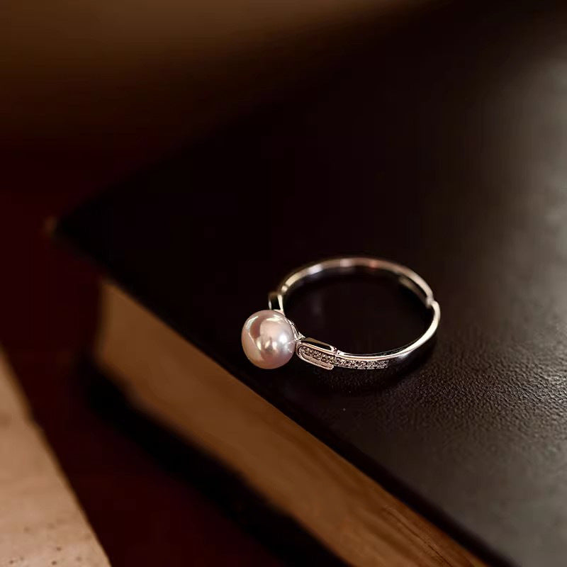 Damen zierlicher Ring mit eleganter Perle und funkelnden Zirkonia-Shop Nory