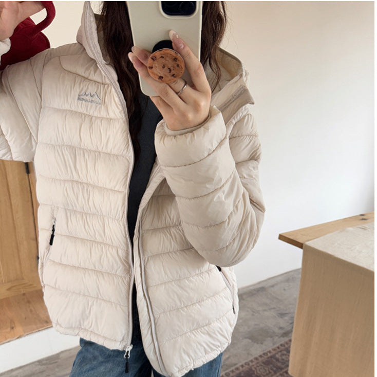 Damen ultraleichte Pufferjacke mit abnehmbarer Kapuze und elastischem Saum