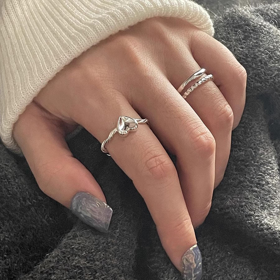 Damen herzförmiger Silberring mit elegantem Drehdesign Shop Nory