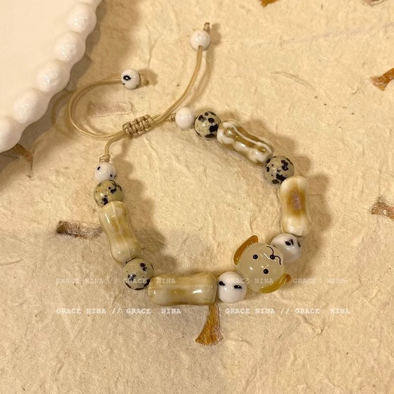Damen Armband mit bunten Tiermotiven und charmanten Anhängern Shop Nory