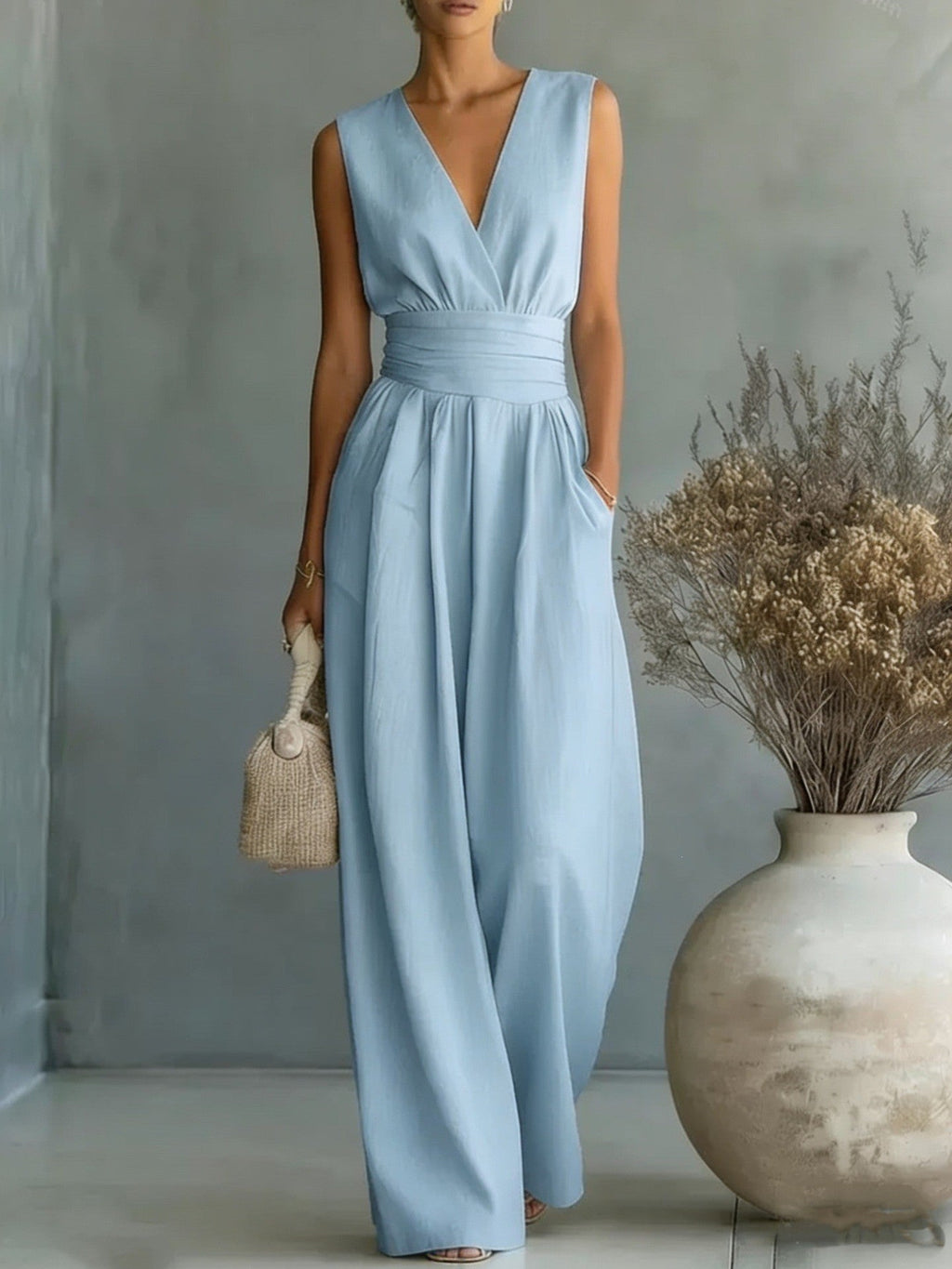 Eleganter Ärmelloser Jumpsuit mit Tiefem V-Ausschnitt, Taillenbund und Weitem Bein