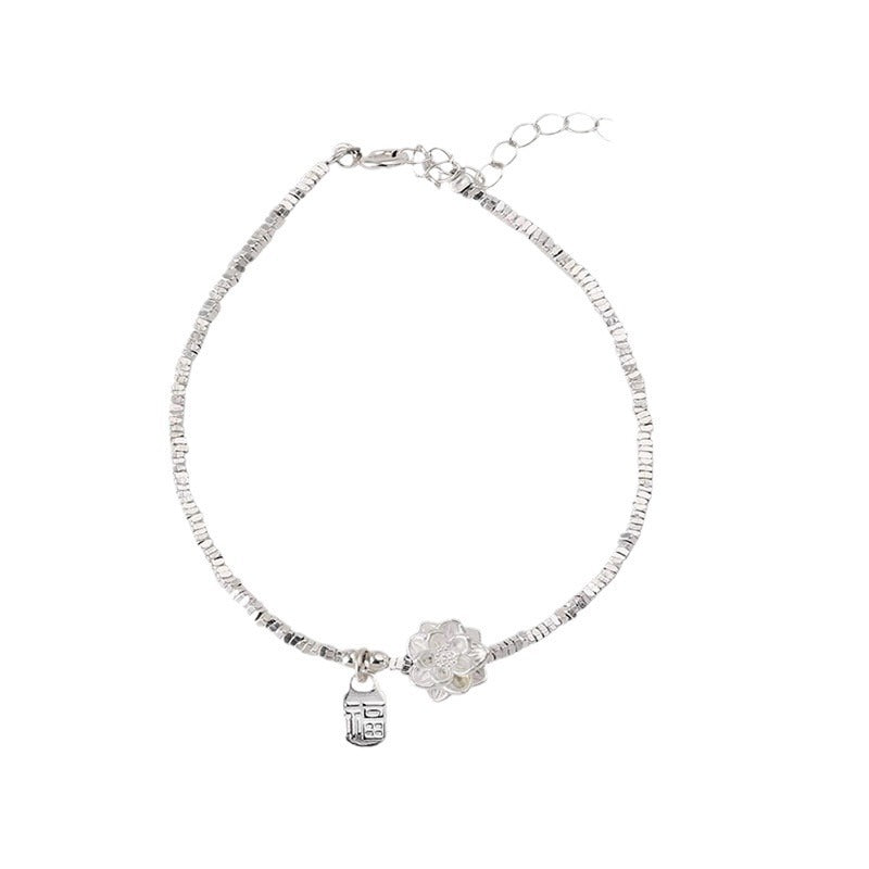 Damenarmband mit kunstvollem Blumenmotiv und funkelnden Zirkonia-Elementen Shop Nory