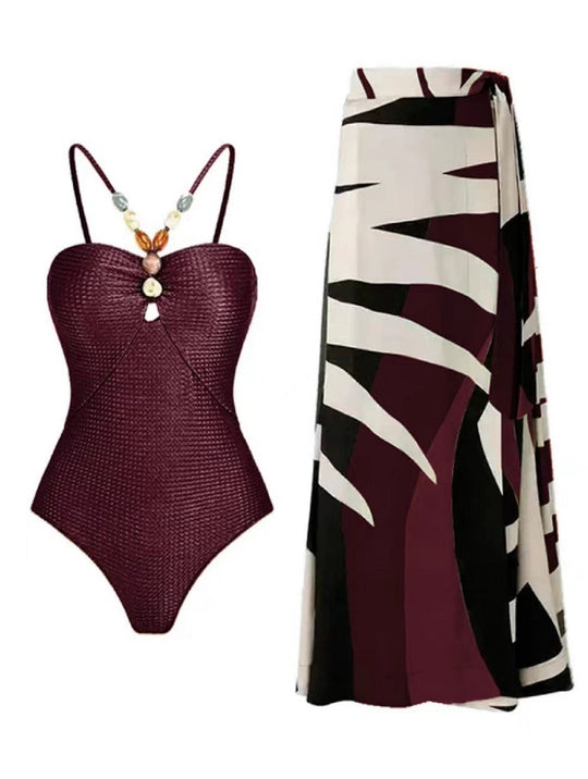 Damen Badeanzug mit elegantem Wickelrock und modischen Schmuckdetails