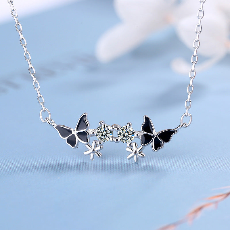 Damen Halskette mit filigranem Schmetterlings- und Blumenmotiv Shop Nory