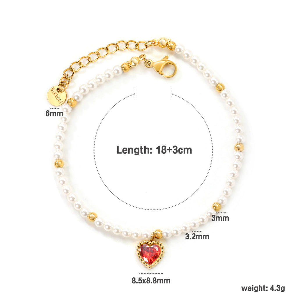 Damen Armband mit schimmernden goldenen Perlen und funkelndem Herzanhänger Shop Nory