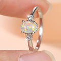 Damen Ring mit schimmerndem Opal und funkelnden Zirkonia Shop Nory