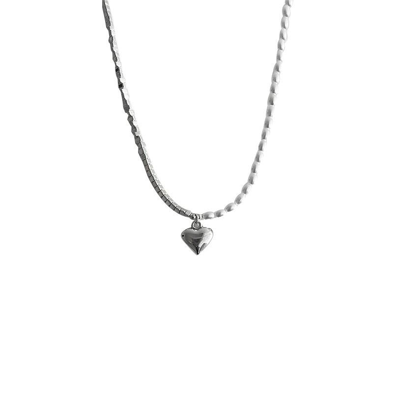 Damen Kette mit elegantem Herzanhänger und perlenschimmernden Akzenten Shop Nory