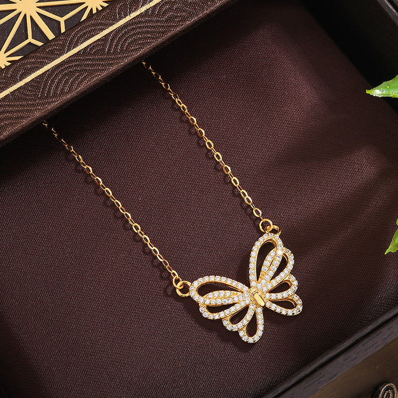 Damen Halskette mit filigranem Schmetterlingsanhänger und funkelnden Zirkonia Shop Nory
