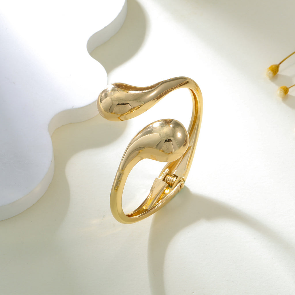 Damen Armspange im modernen, skulpturalen Gold-Design Shop Nory