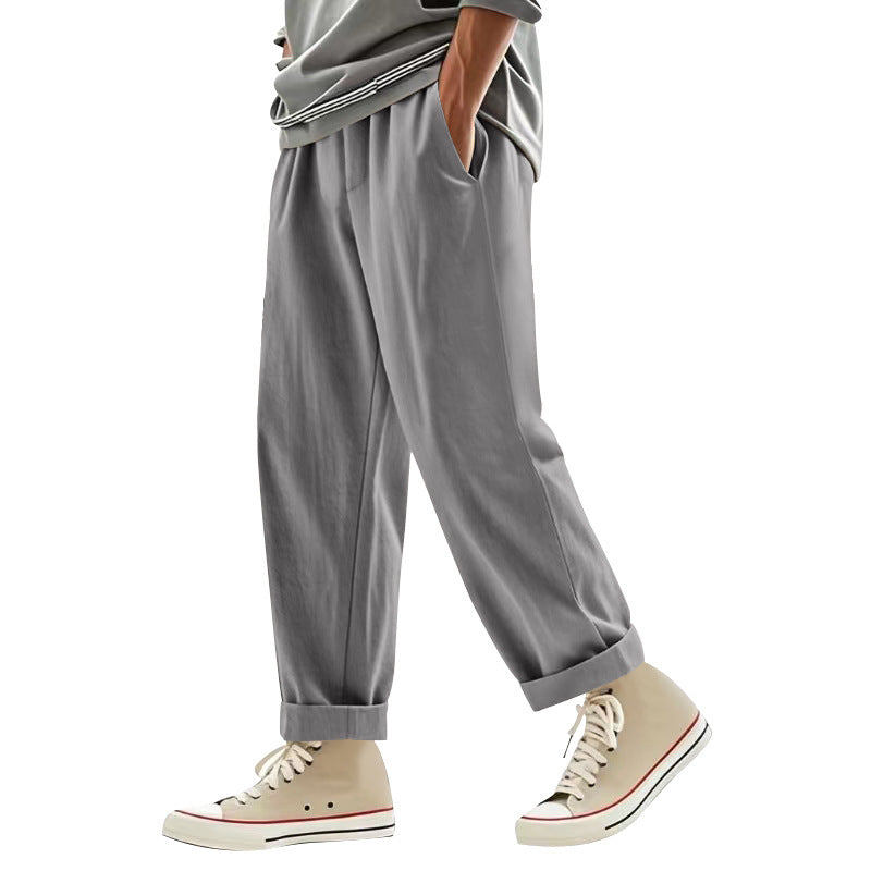 Herren nan weite Bundfalten-Chinohose mit Umschlag, konisch zulaufendem Schnitt und seitlichen Eingrifftaschen