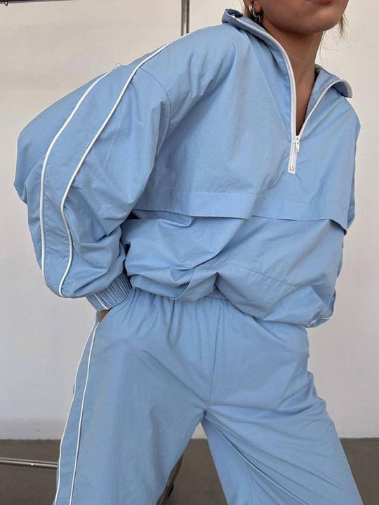 Damen winddichter Crop-Halfzip-Trainingsanzug mit elastischem Bund und kontrastierender Paspel Shop Nory
