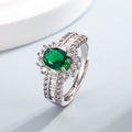 Oval simulierte Edelstein Halo-Verlobungsring mit Mikro Pavé Zirkonia und Baguette-Akzenten
