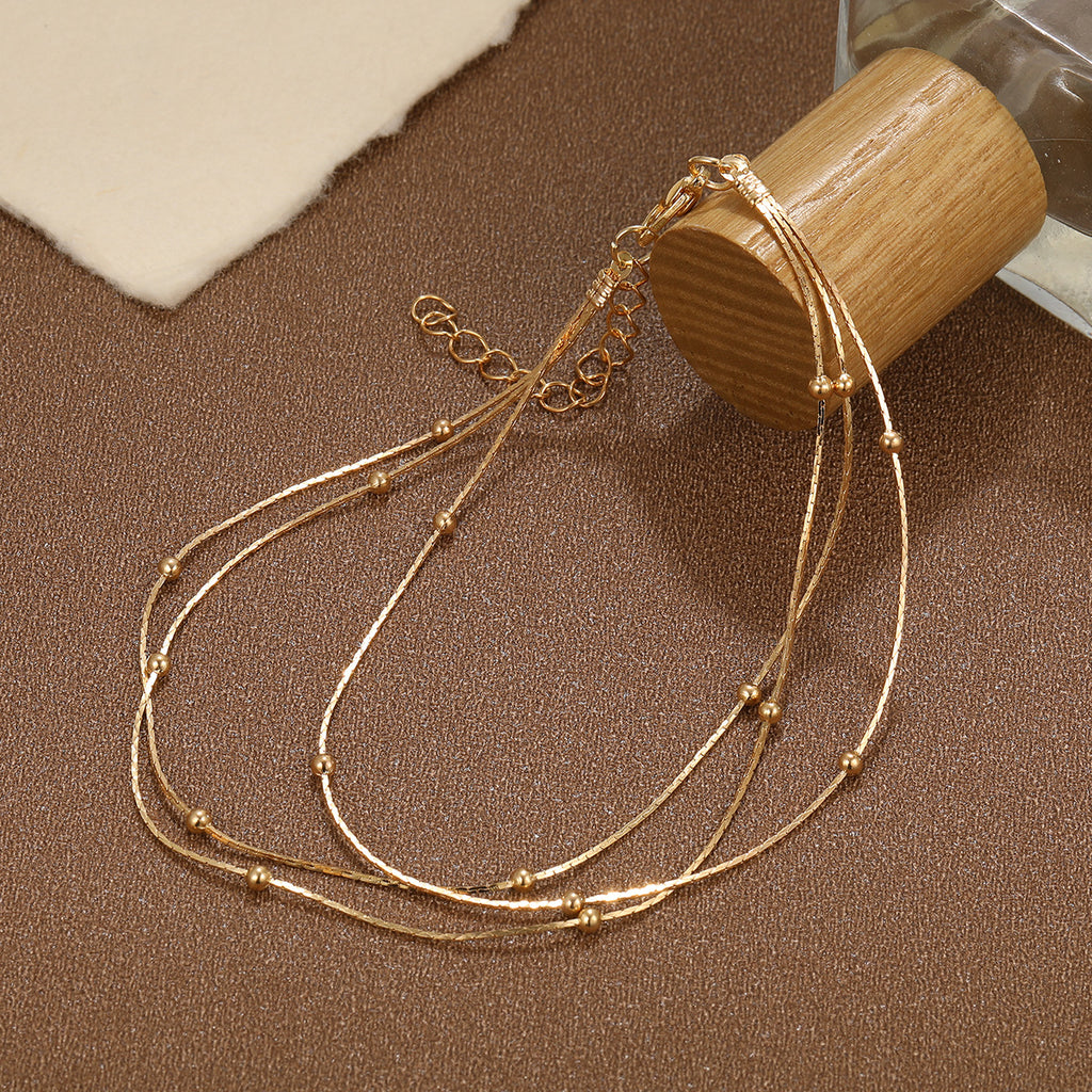 Damen Fußkettchen mit eleganten, goldenen Akzenten Shop Nory