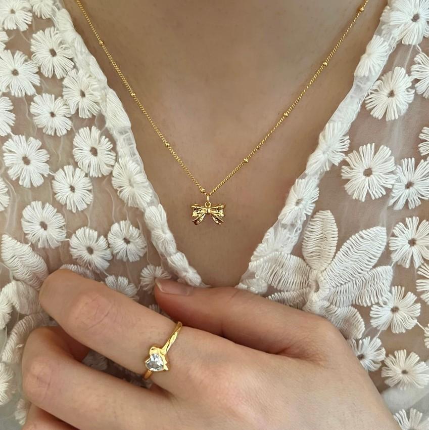 Damen Halskette mit filigranem Schleifenanhänger und hochwertiger Gliederkette Shop Nory